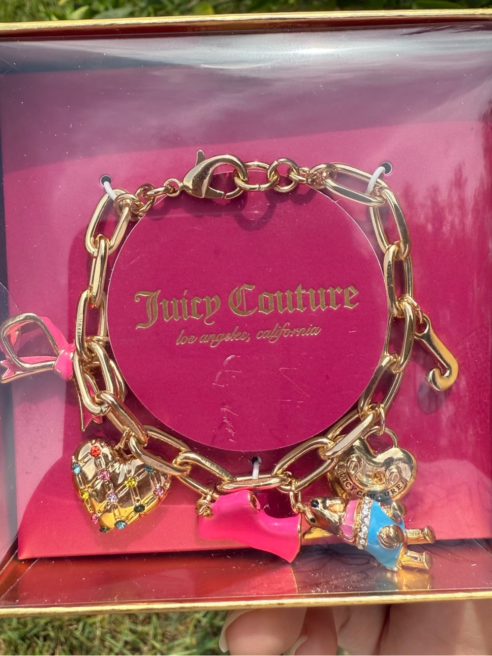 Juicy Couture Gold Tone Charm Bracelet with Pink and Multicolor Accents